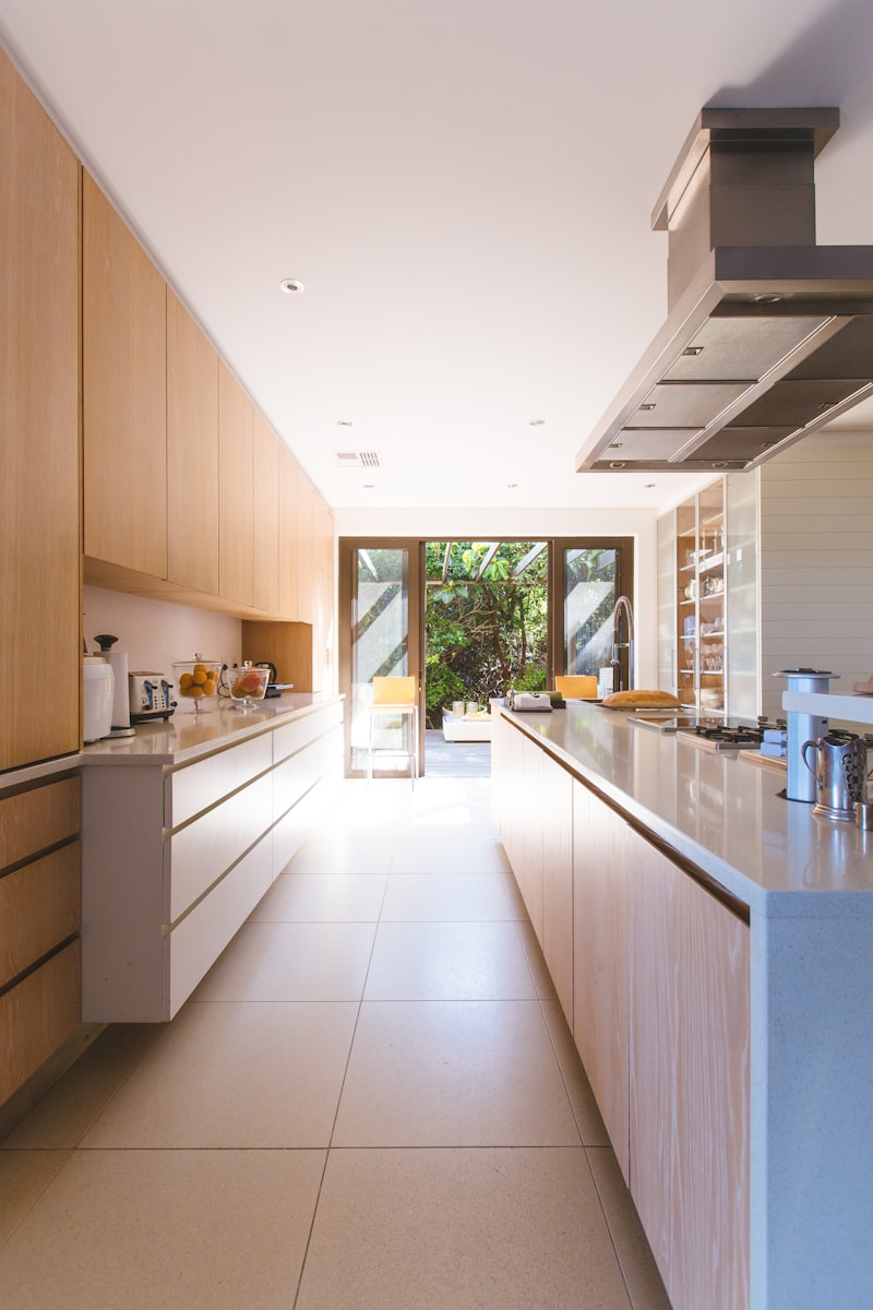 Bright open plan kitchen leading to a garden courtyard