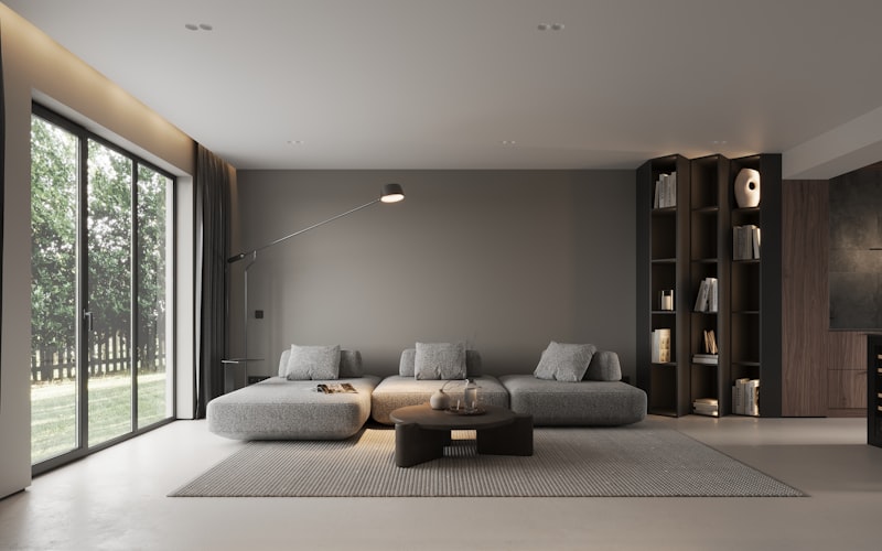 Warm walnut toned living room with built in shelving, a completed Loam and Line project